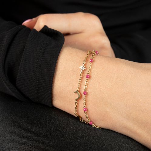Goudkleurige armband met roze kraaltjes