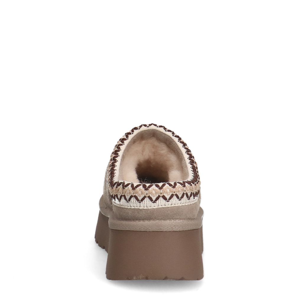 Beige suède instappers met wol