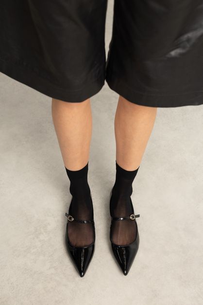 Schwarze Lack-Ballerinas
