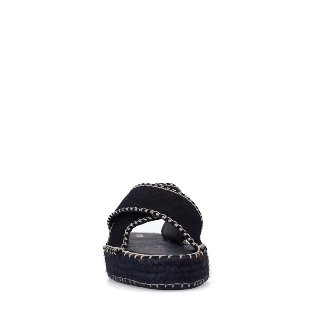 Zwarte suède slippers met witte stiksels