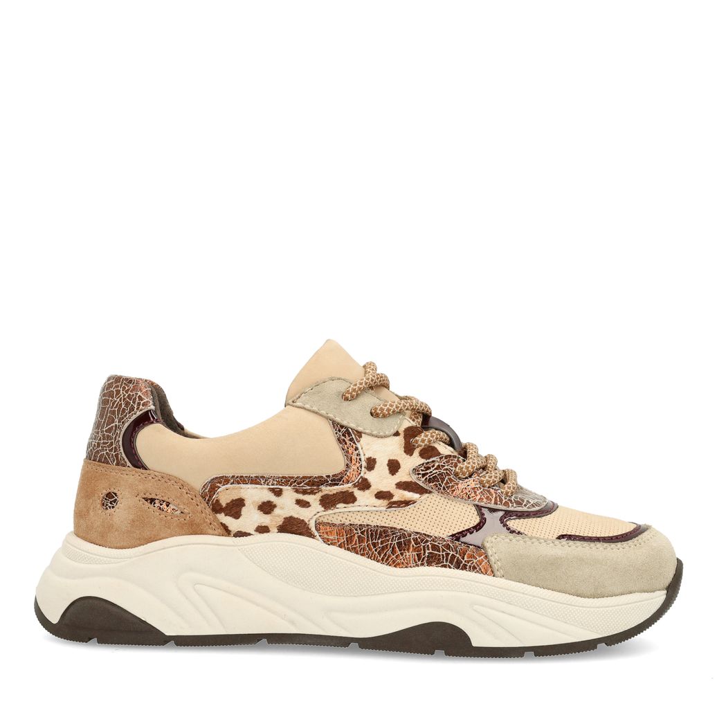 Beigefarbene Sneaker mit Kuhfellmuster