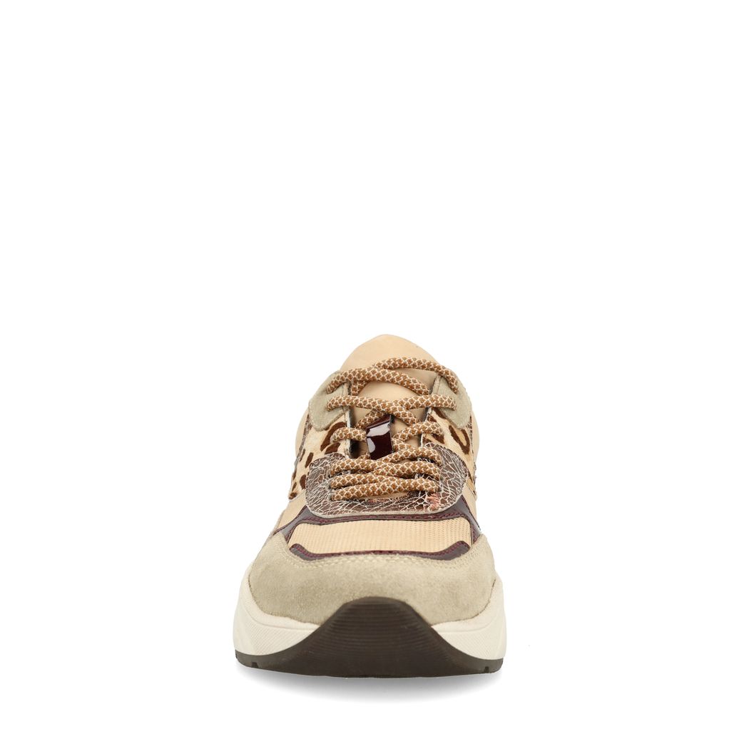 Beigefarbene Sneaker mit Kuhfellmuster