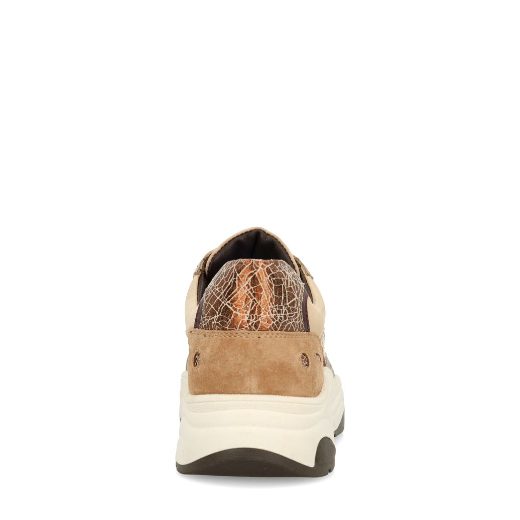Beigefarbene Sneaker mit Kuhfellmuster