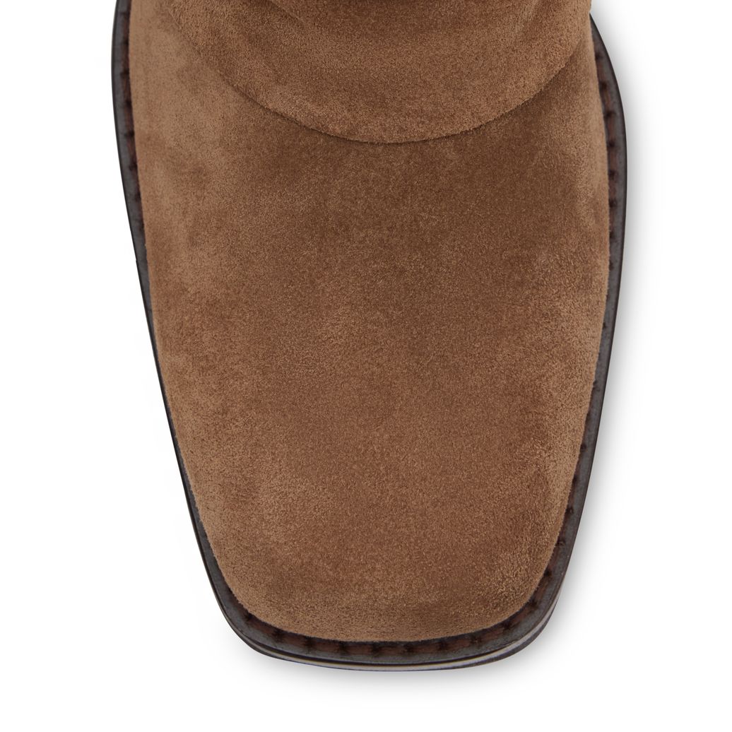 Beigefarbene Velourslederstiefel mit Fransen und Umschlag
